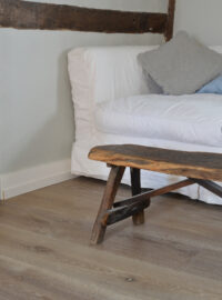 Oak landmark dyrham planks with a white sofa and a wooden bench