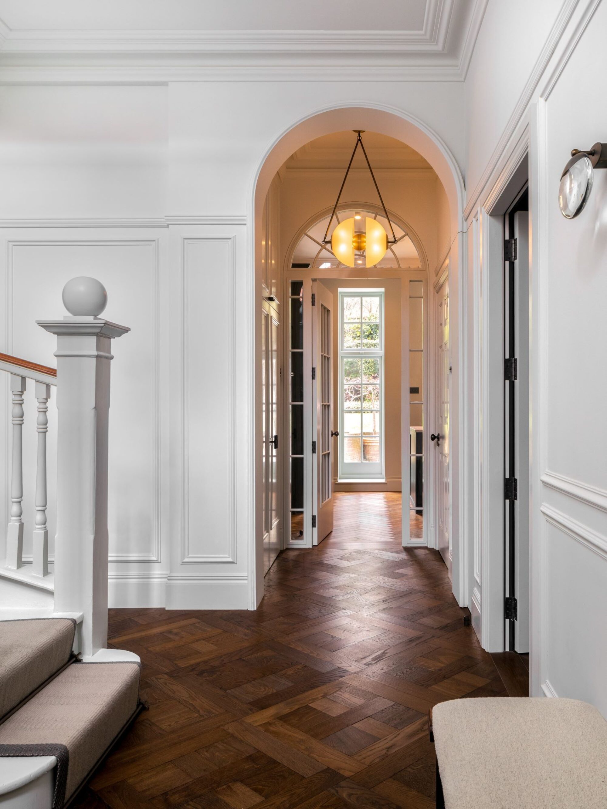 Dark brown Landmark Knole oak Cross panel parquet with border in hallway of Edwardian Villa in London