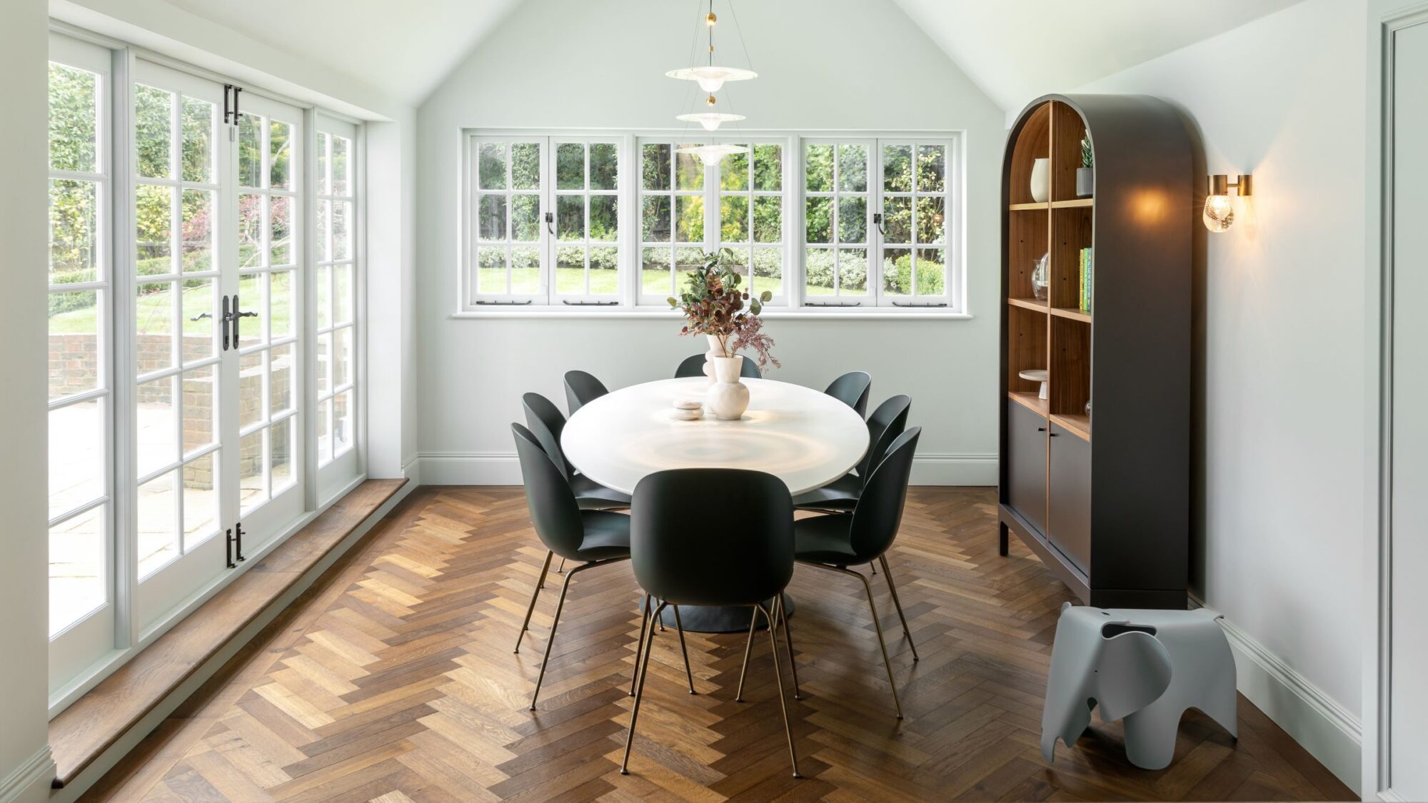 Dark brown Landmark Knole oak herringbone parquet in diningroom