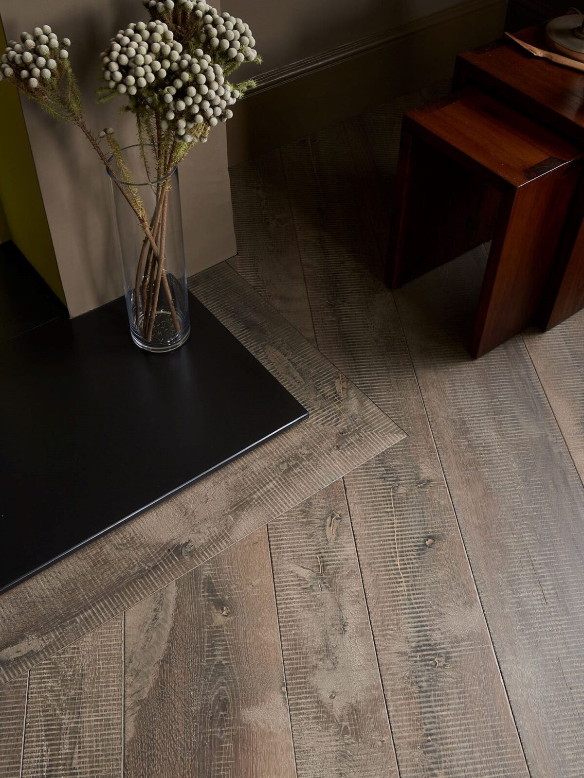 rustic oak flooring & hearth surround with flower displayy