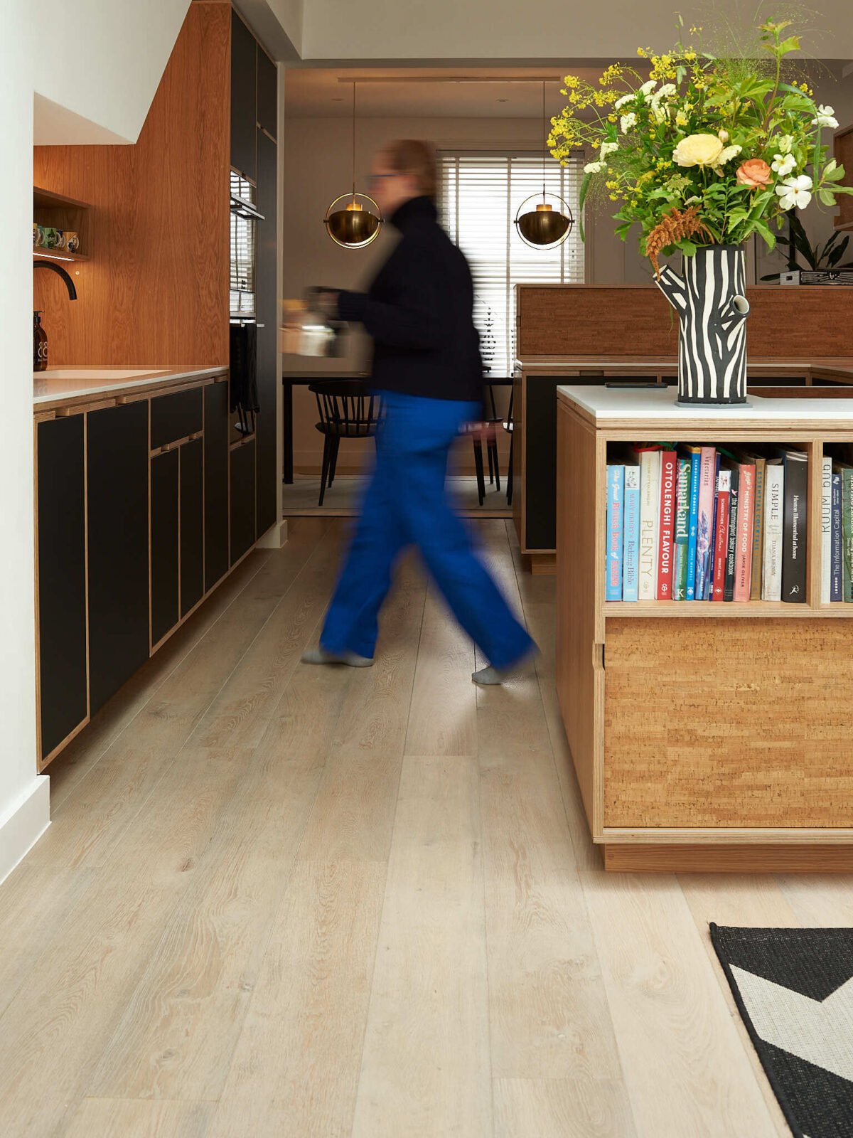 cool blonde oak floor in kitchen with person