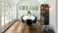 Dark brown Landmark Knole oak herringbone parquet in diningroom