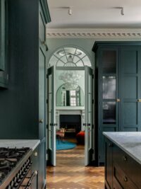 Dark brown Landmark Knole oak herringbone parquet in kitchen