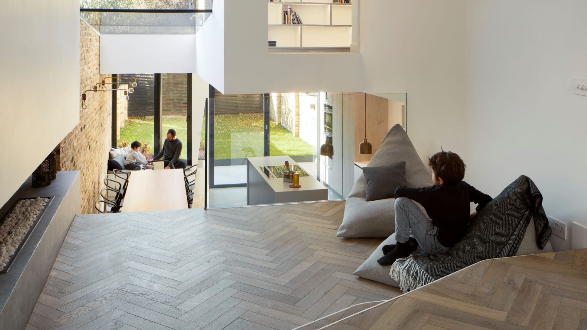 Tate bute herringbone floor with beanbag looking into kitchen by scenario architecture image by M Clayton 3