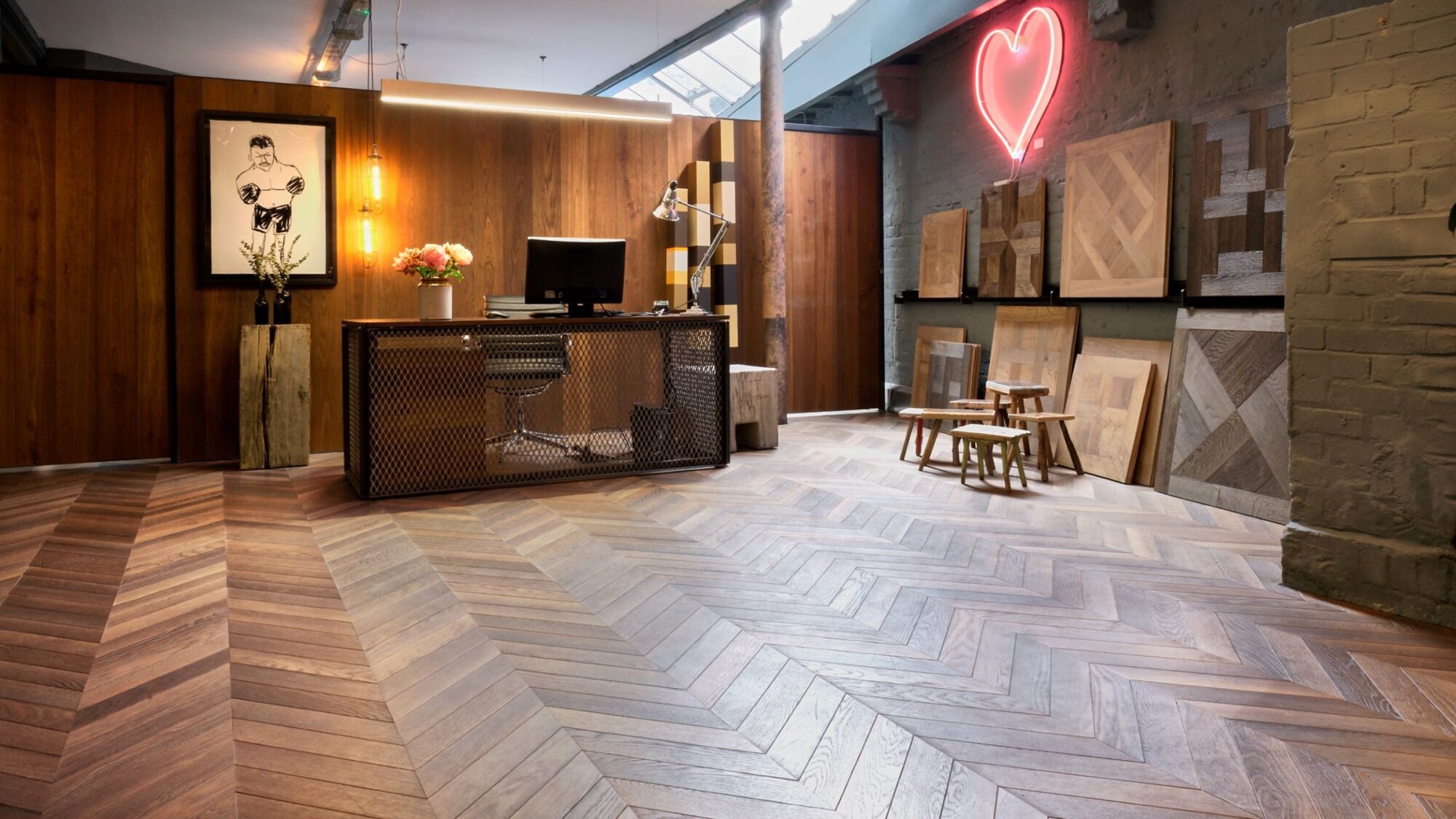 solid floor london showroom east desk on chevron floor & neon heart