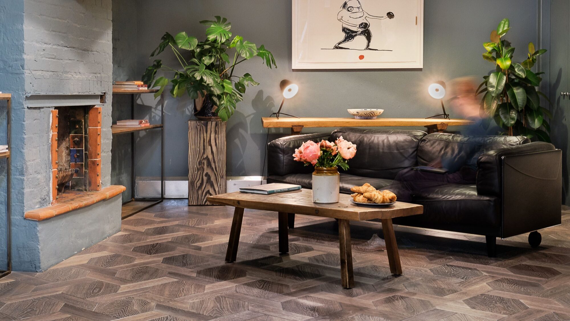 Solid floor london snug in showroom with fireplace black leather sofa on mansion weave oak flooring