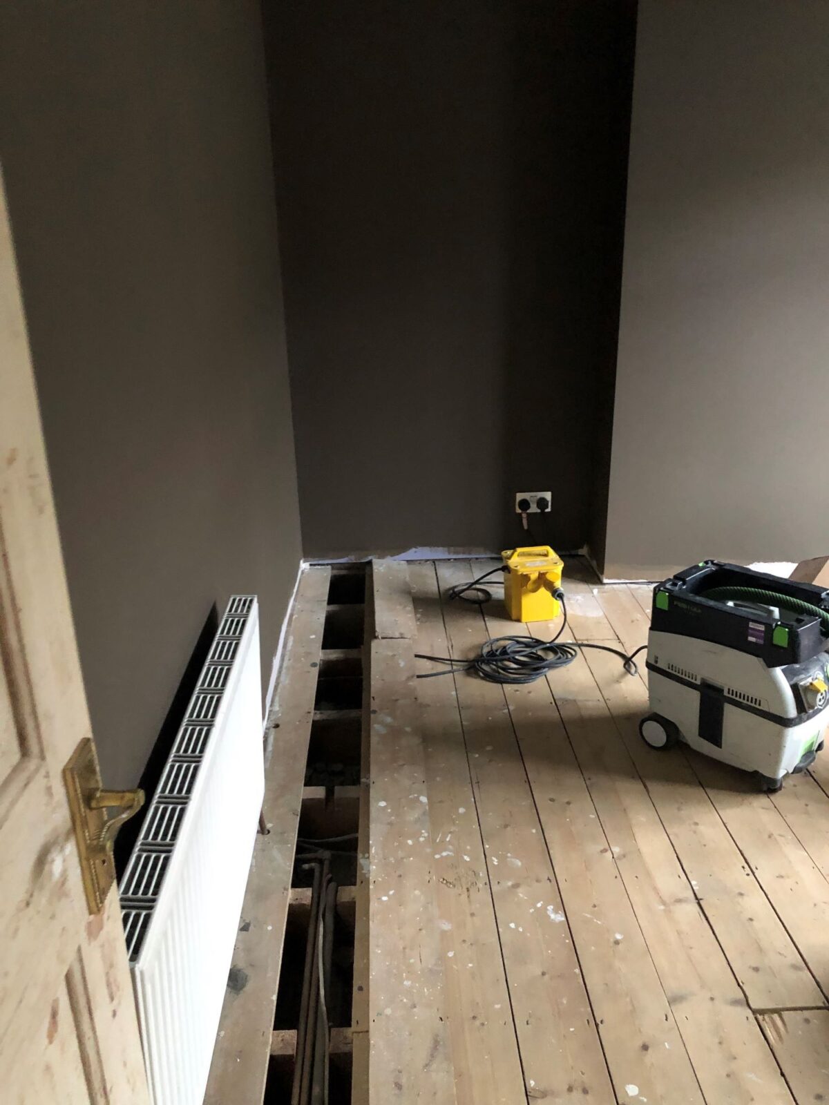 working on subfloor & old pine floorboards