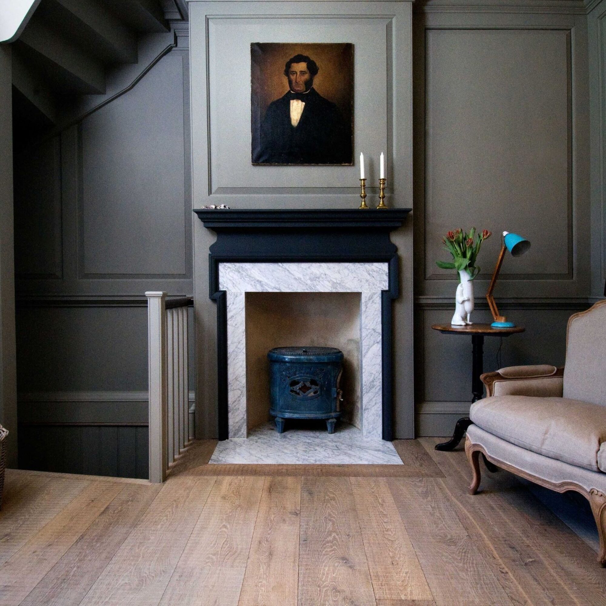 Tate bute flooring with grey panelling marble fireplace and portrait