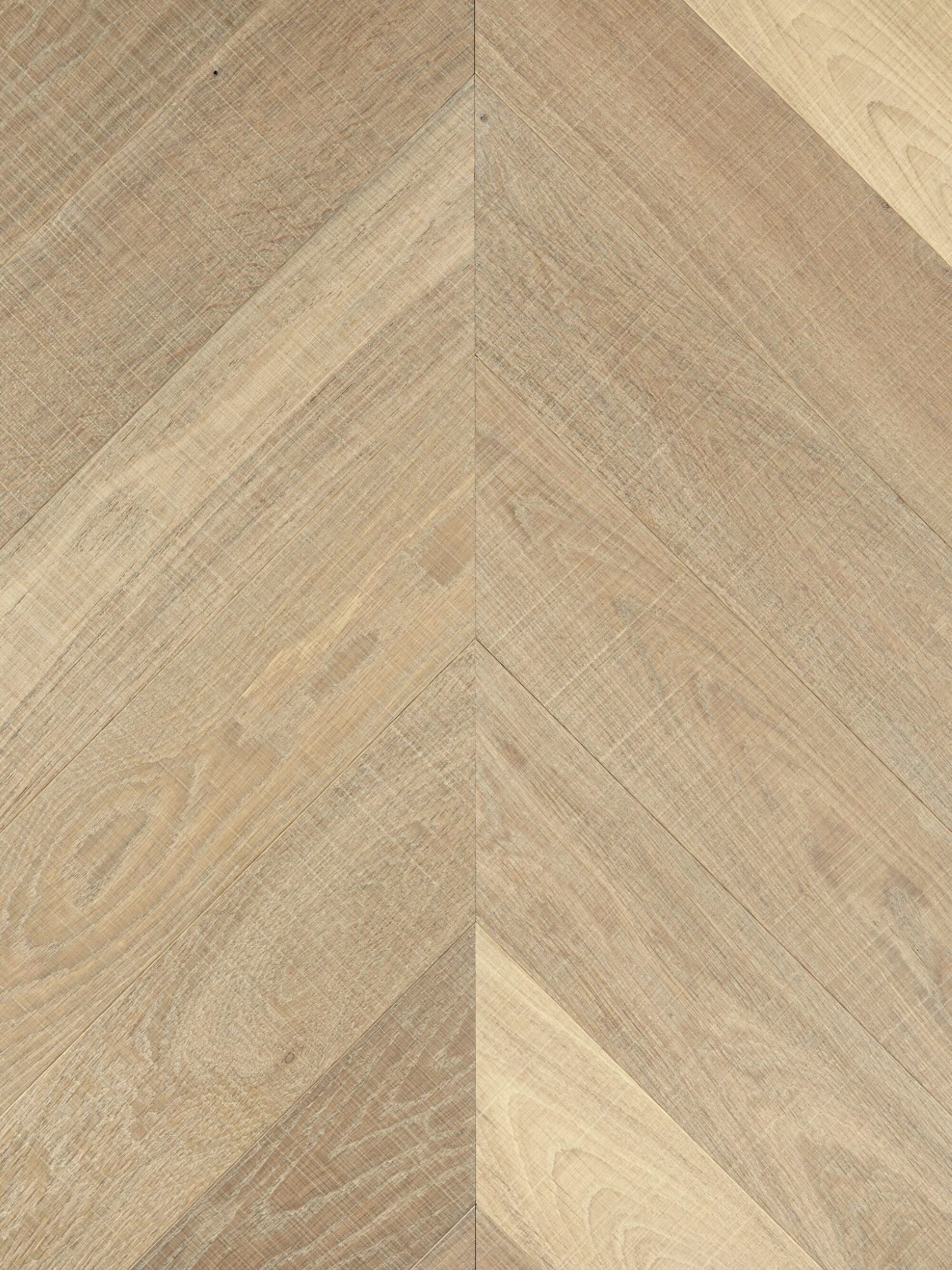 Light tate skye oak chevron parquet flooring with visible horizontal bandsaw marks