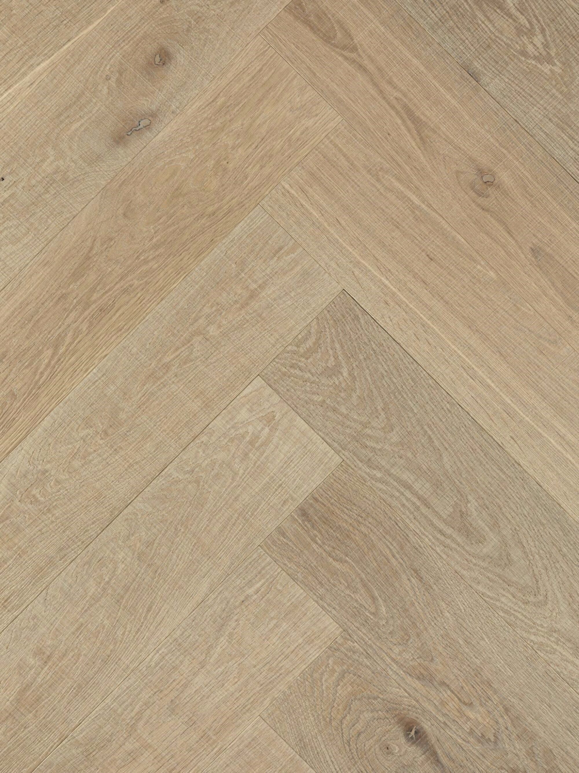 Light tate skye oak herringbone parquet flooring with visible horizontal bandsaw marks