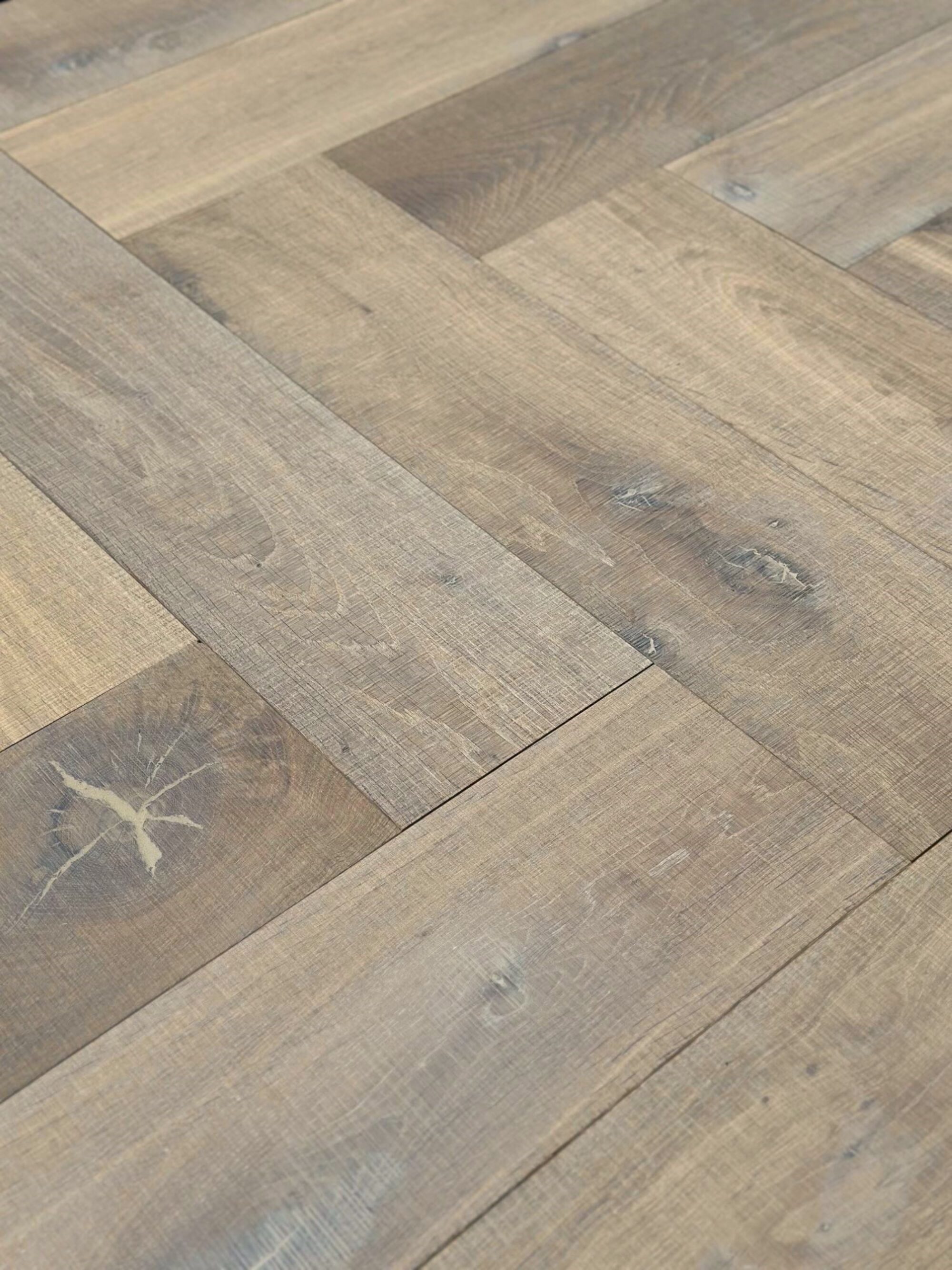 neutral textured tate bute band sawn herringbone parquet oak flooring sale special offer