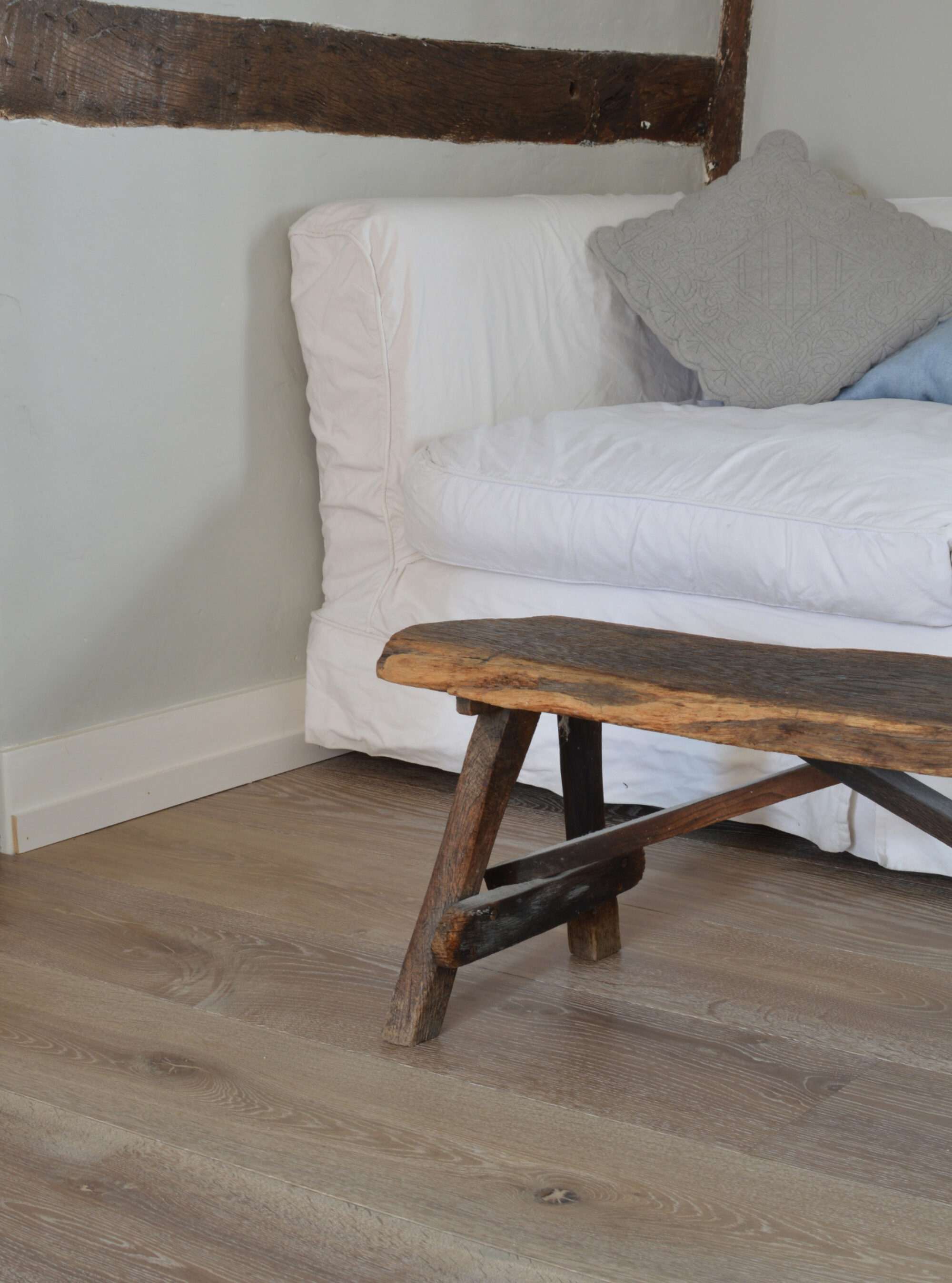 Oak landmark dyrham planks with a white sofa and a wooden bench