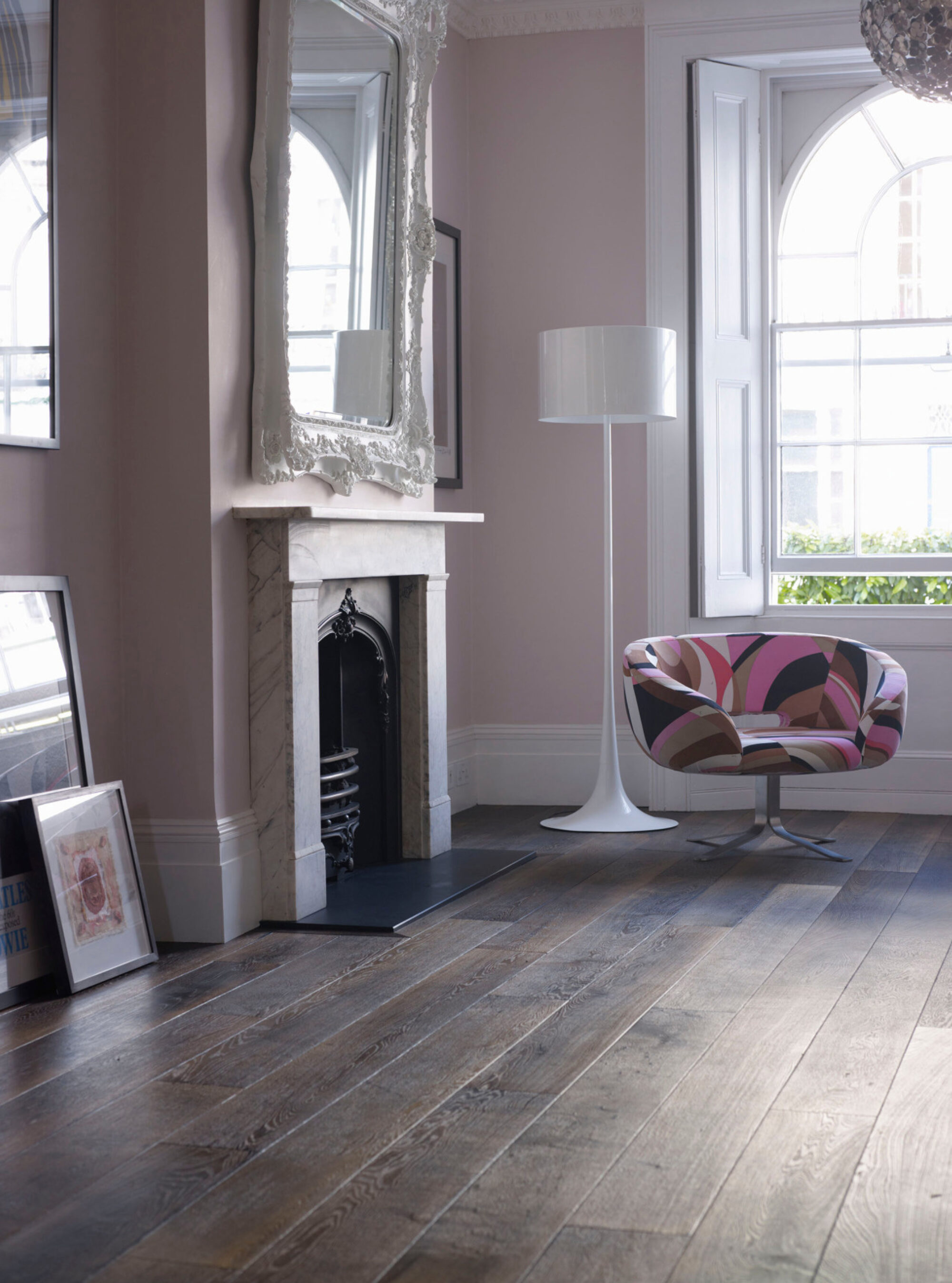 Oak landmark killerton plank dark brown engineered floor with pink walls fireplace and pink chair
