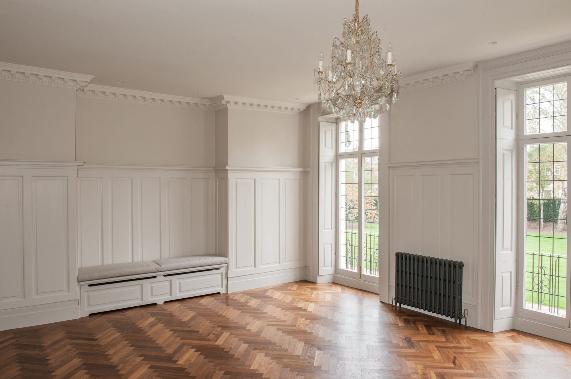 Oak landmark tatton herringbone with paneled walls and built in bench