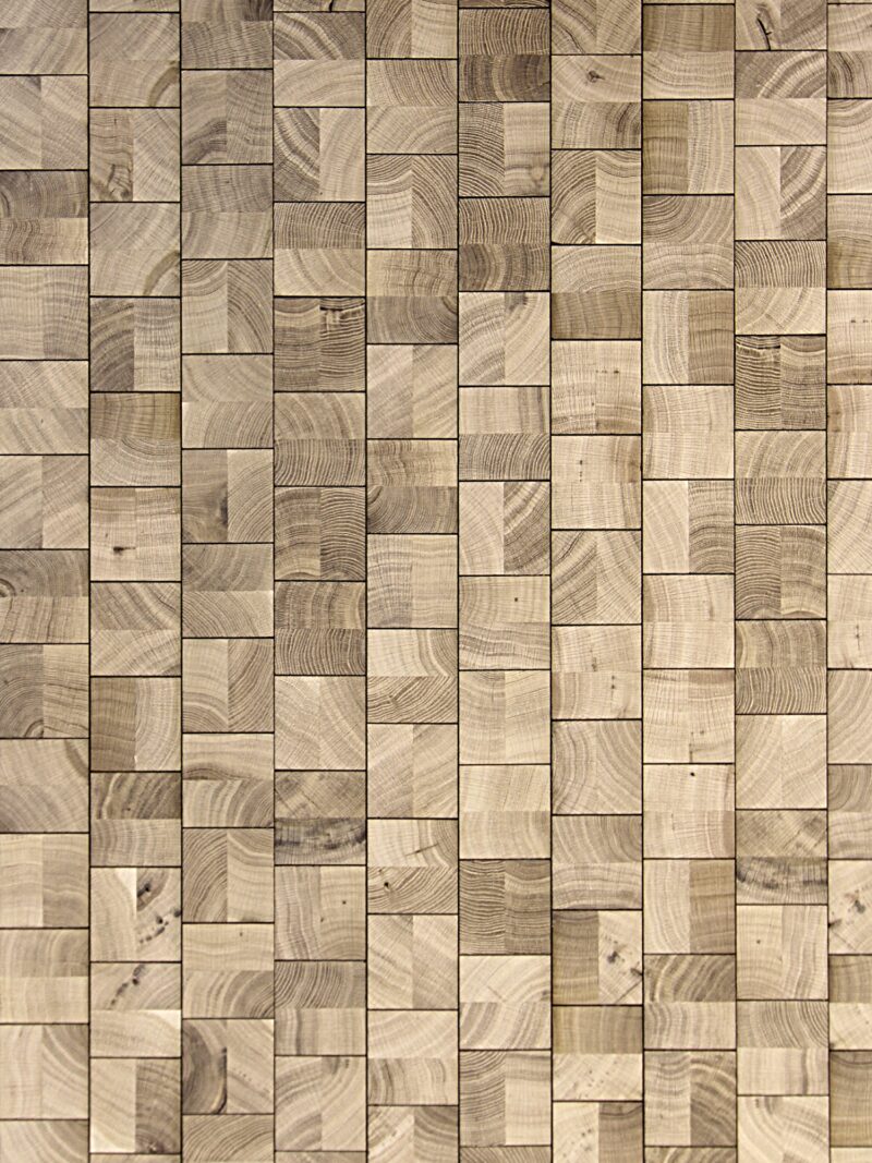 Cube Natural end-grain oak flooring by OscarOno: pale, natural-toned square blocks laid in staggered vertical rows, with strong growth-ring patterns, small knots and soft variation between light and darker blocks