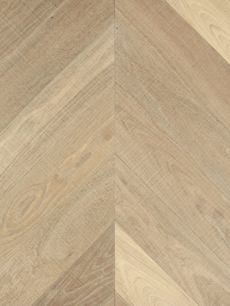 Light tate skye oak chevron parquet flooring with visible horizontal bandsaw marks