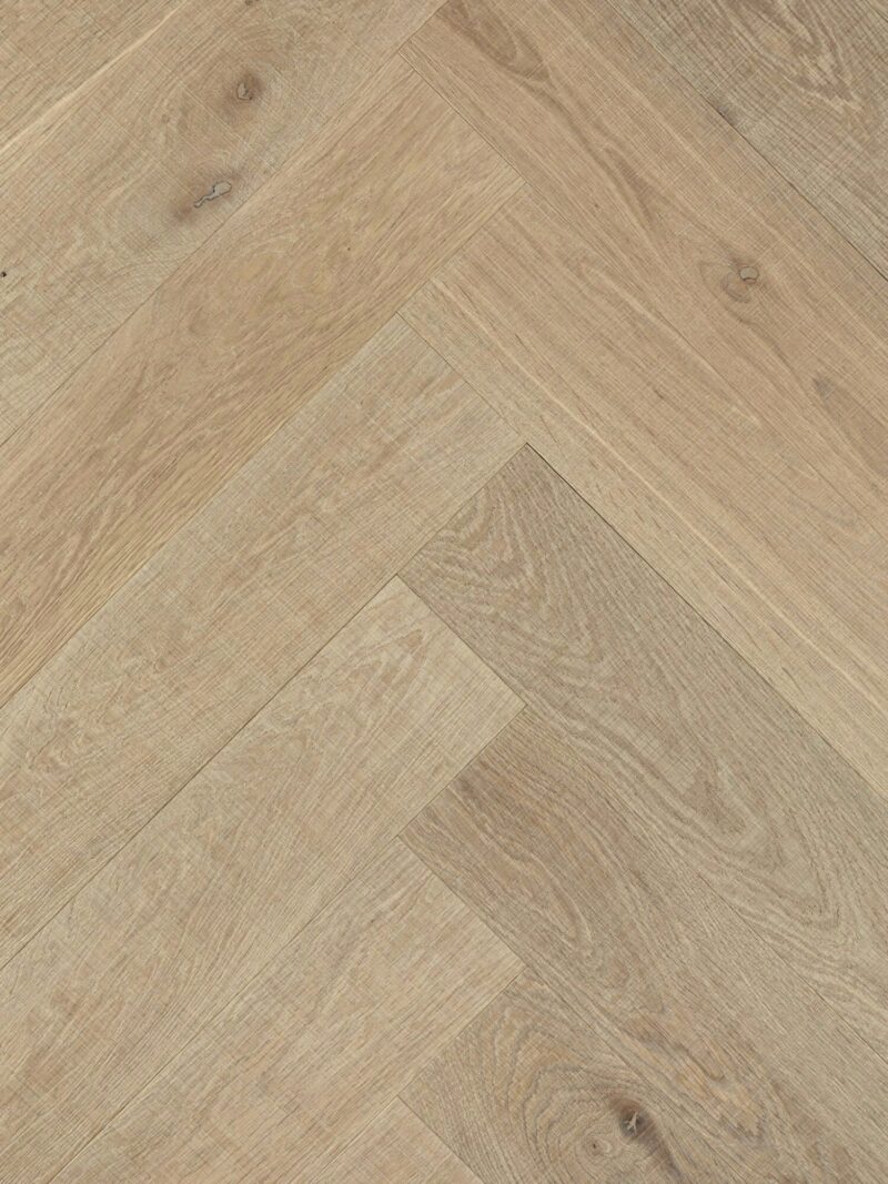 Light tate skye oak herringbone parquet flooring with visible horizontal bandsaw marks