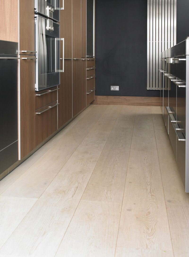 Oak polar white plank in kitchen with wall radiator