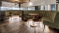 Dark oak flooring magma stromboli in workspace with green benches