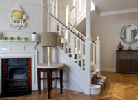 Oak landmark dalton herringbone with staircase and traditional fireplace and mirror