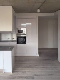 Solid floor grey textured oak citadel open plan kitchen